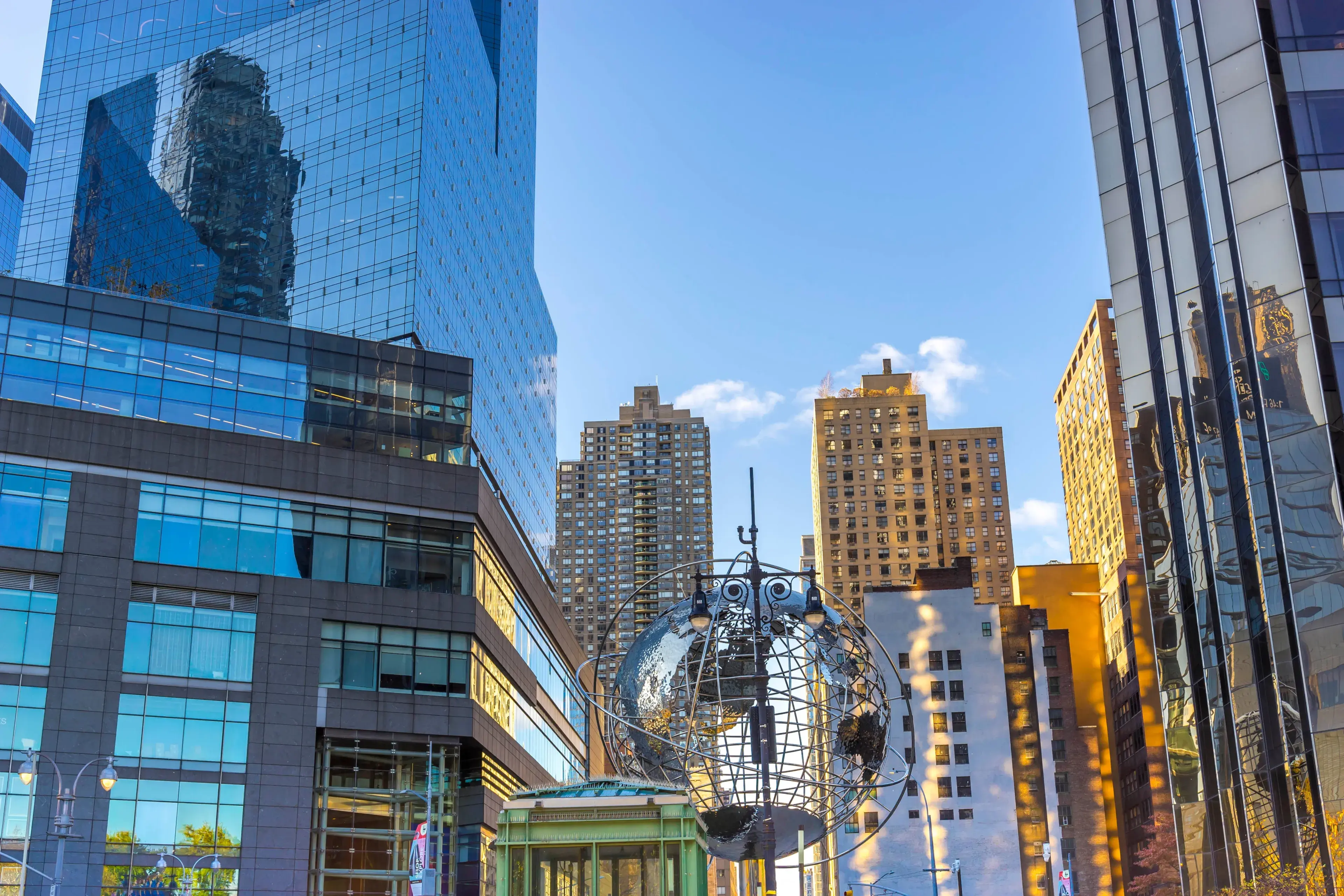 NEW YORK CITY - 0CT 11 2021: The contemporary architecture of New York with the iconic Globe sculpture NEW YORK CITY - 0CT 11 2021: The contemporary architecture of New York with the iconic Globe sculpture