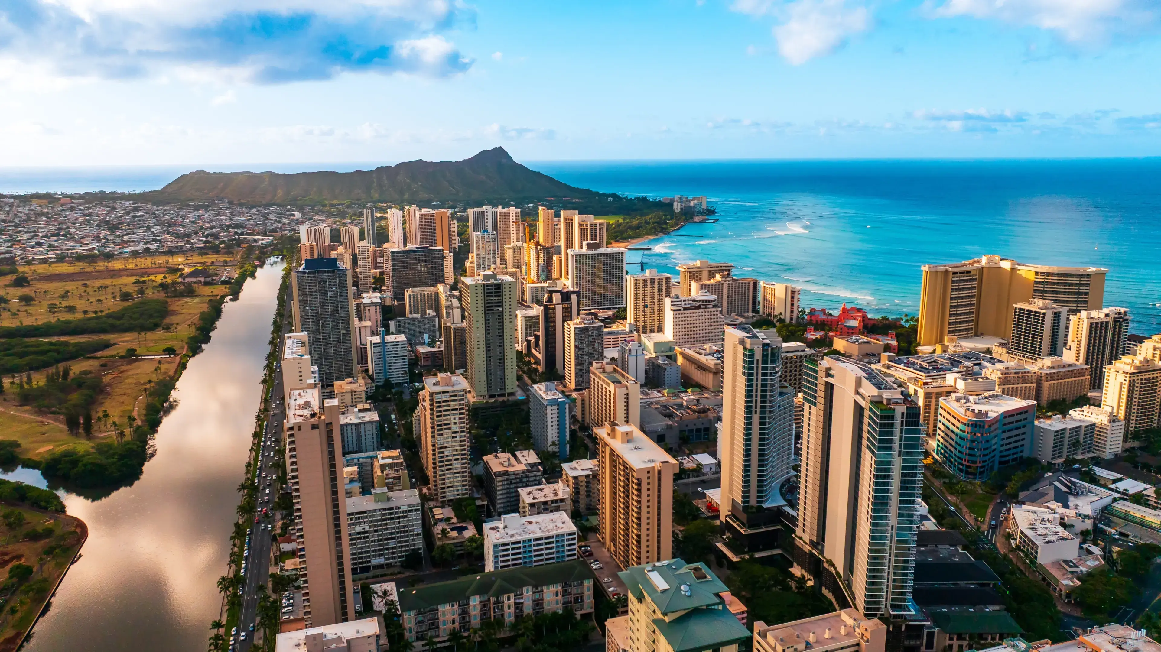 Modern high-rise downtown of Honolulu, Hawaii, USA. Diamond Head Crater at backdrop. Aerial view. Modern high-rise downtown of Honolulu, Hawaii, USA. Diamond Head Crater at backdrop. Aerial view.
